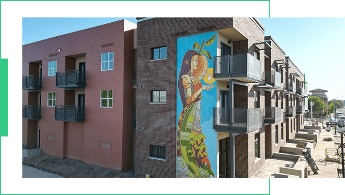 A building with a mural on the side of it.