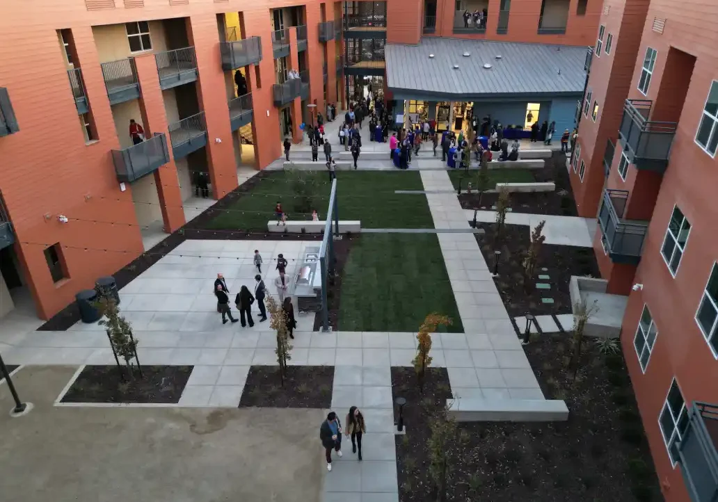 A courtyard with people walking around it